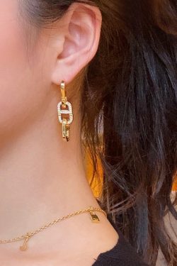 High-End Geometric Oval Linked Black and White Enamel Drip Glaze Diamond-Inlaid Gold-Plated Earrings for Elegant Style